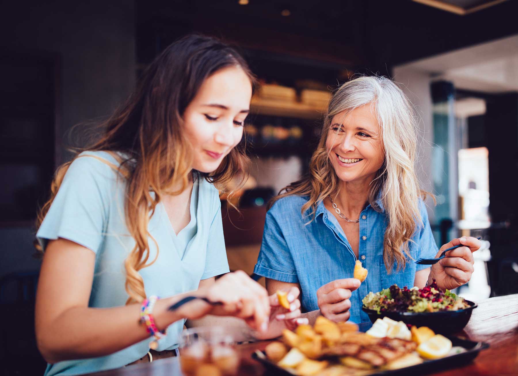 Mother and daughter enjoying a meal together